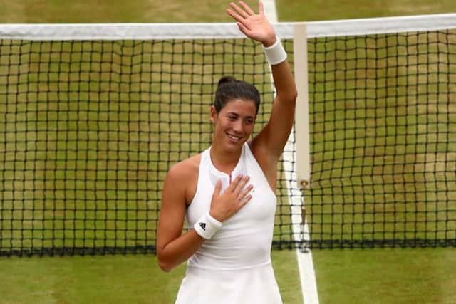 Garbine Muguruza salutes the Centre Court crowd following her victory. Picture: Getty.