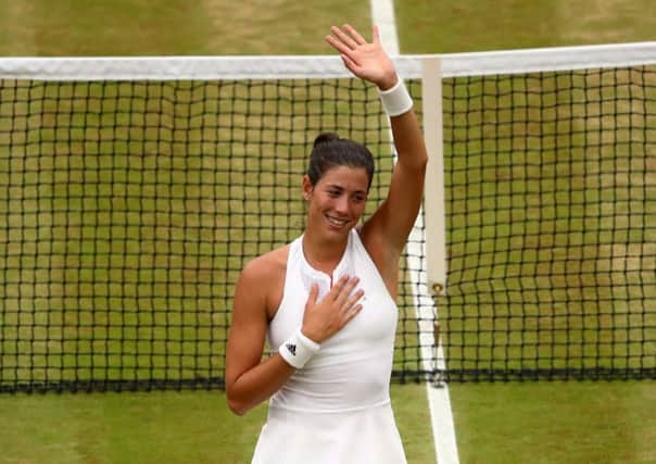 Garbine Muguruza salutes the Centre Court crowd following her victory. Picture: Getty.