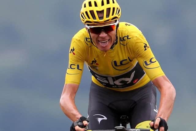 Chris Froome still in yellow after Stage 15 despite having to stop for a wheel change. Picture: Getty.