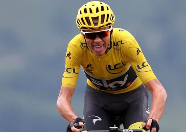 Chris Froome still in yellow after Stage 15 despite having to stop for a wheel change. Picture: Getty.