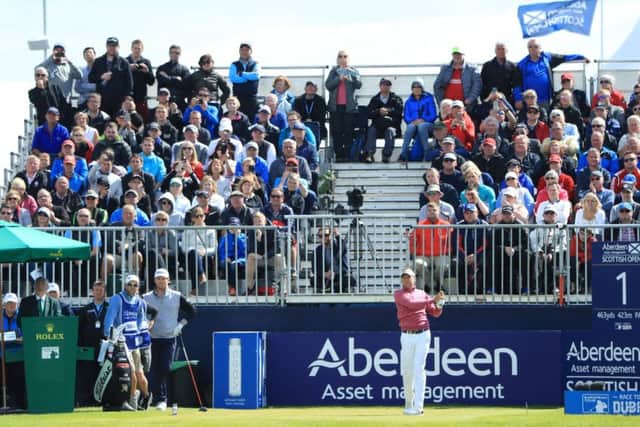 Ian Poulter of England tees off in front of crowds at Dundonald Links Golf Course. Picture: Andrew Redington/Getty Images