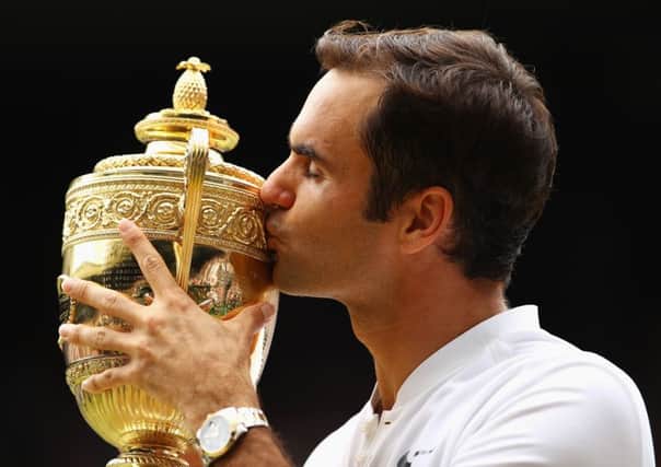 Wimbledon champion Roger Federer predicts that Andy Murray will bounce back from his hip injury. Picture: Getty.