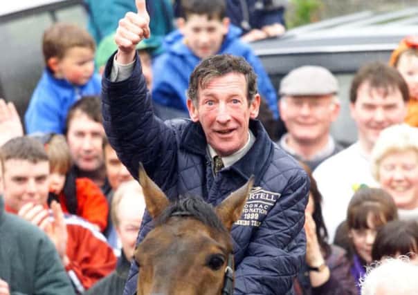 Trainer Tommy Carberry celebrates with Grand National winner Bobbyjo in his home village of Ratoath, north of Dublin.