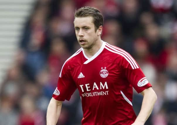 Kari Arnason has re-signed for Aberdeen five years after leaving the club. Picture: SNS