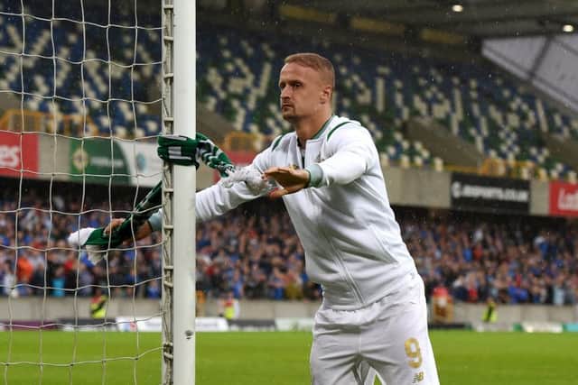 Leigh Griffiths tied a Celtic scarf around the post after full-time. Picture: Getty