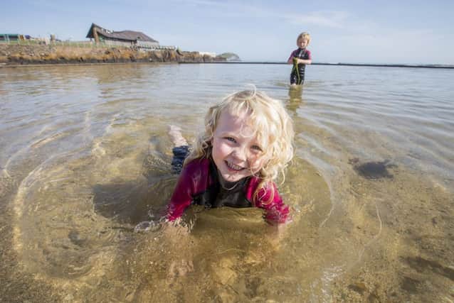 Five-year-old Roe Ward and her three-year-old sister Lucy enjoy the hot sunny weather with a swim in North Berwick's tide pool
