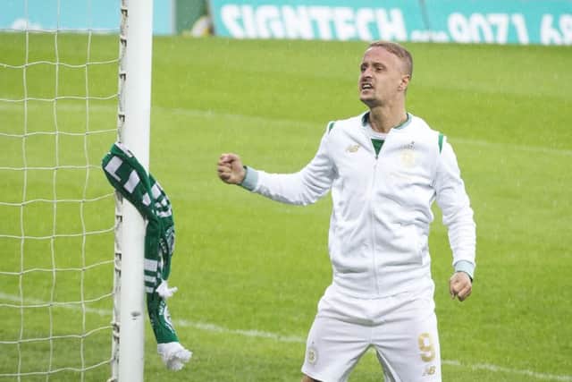 Leigh Griffiths after tying a Celtic scarf to the goal post following the win in Belfast. Picture: PA