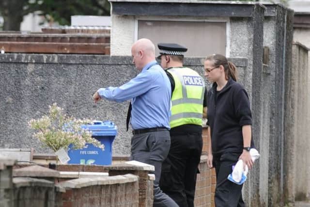 Police officers search a house in Glenrothes in relation to missing man Allan Bryant. Picture: George Mcluskie