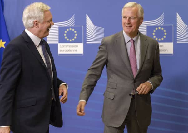 Michael Barnier and David Davis. Picture: AP