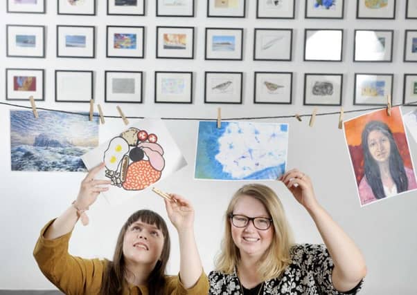 Clare Robertson and Celeste Clark with examples of their work and other artists. Picture: Supplied