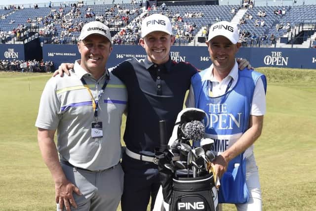 Young Scottish amateur golfer Connor Syme and his father, Stuart, and caddie Tim Poyser at the 18th green after finishing his practice round.
Picture Ian Rutherford.