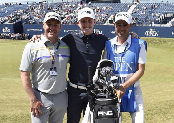 Young Scottish amateur golfer Connor Syme and his father, Stuart, and caddie Tim Poyser at the 18th green after finishing his practice round.  
Picture Ian Rutherford.