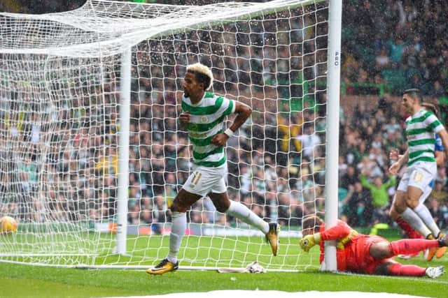 Scott Sinclair wheels away after giving Celtic the early lead. Picture: SNS