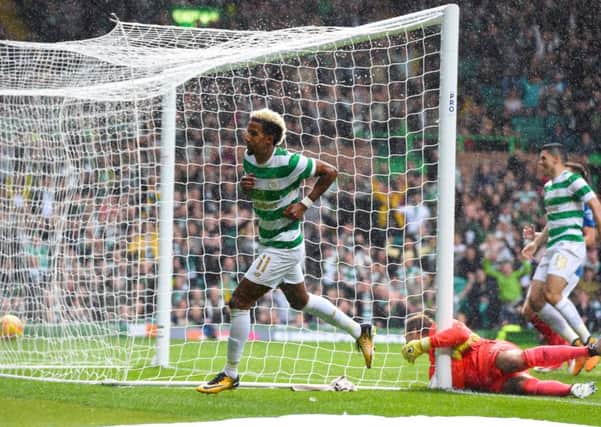 Scott Sinclair wheels away after giving Celtic the early lead. Picture: SNS