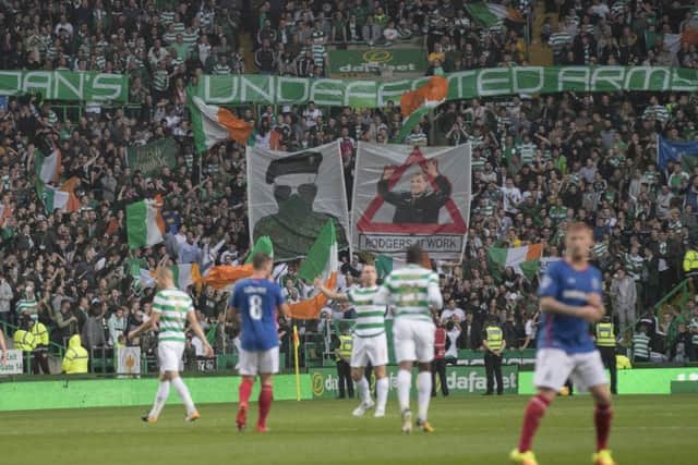 Celtic fans display banners during the second leg clash with Linfield. Picture: Getty