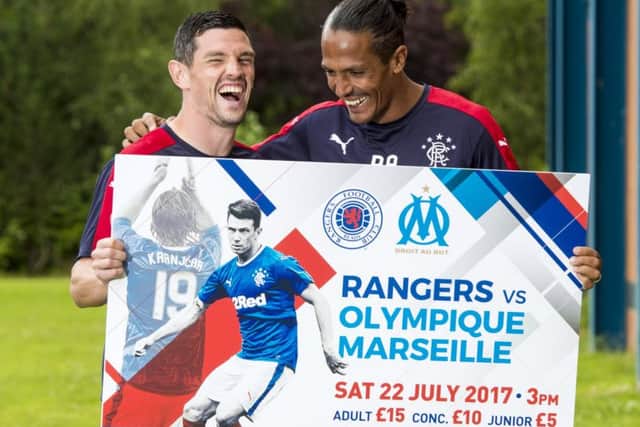 Bruno Alves, right, shares a joke with Rangers team-mate Graham Dorrans. Picture: SNS