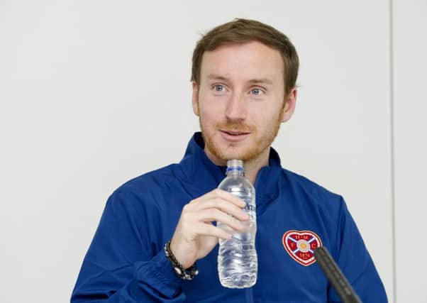 Ian Cathro wants all his players to have the hunger and ambition to progress in their careers. Picture: SNS.