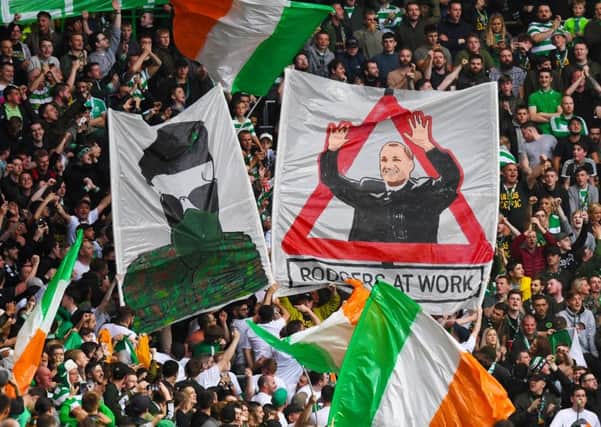 The  banners Celtic fans displayed during the match against Linfield. Picture: SNS