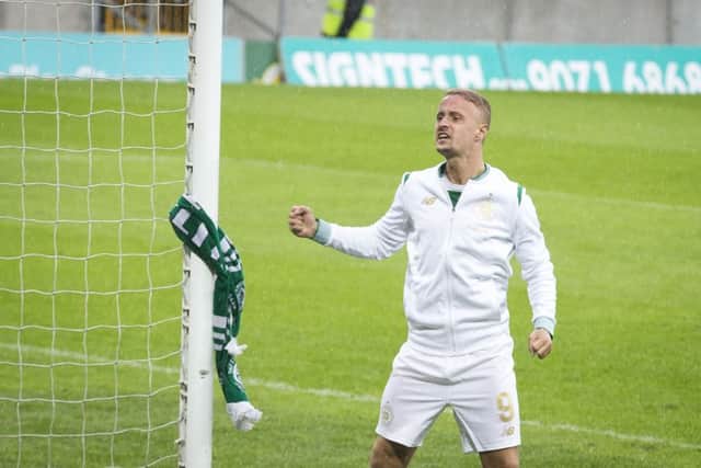 Leigh Griffiths tied a Celtic scarf around the post following the first leg win over Linfield in Belfast. Picture: PA