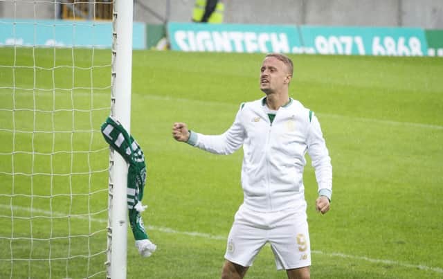 Leigh Griffiths tied a Celtic scarf around the post following the first leg win over Linfield in Belfast. Picture: PA