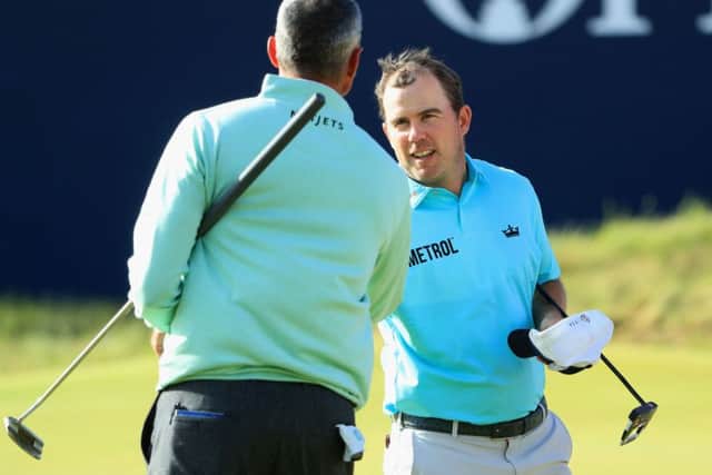 Richie Ramsay shakes hands with Matt Kuchar after the pair fed off each other to make promising starts in the 146th Open Championship. Picture: Andrew Redington/Getty Images)