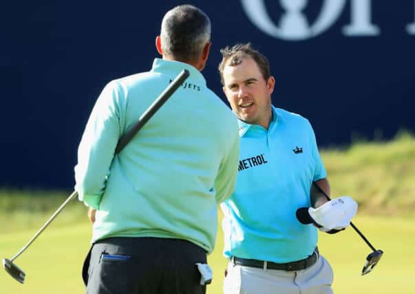Richie Ramsay shakes hands with Matt Kuchar after the pair fed off each other to make promising starts in the 146th Open Championship. Picture: Andrew Redington/Getty Images)