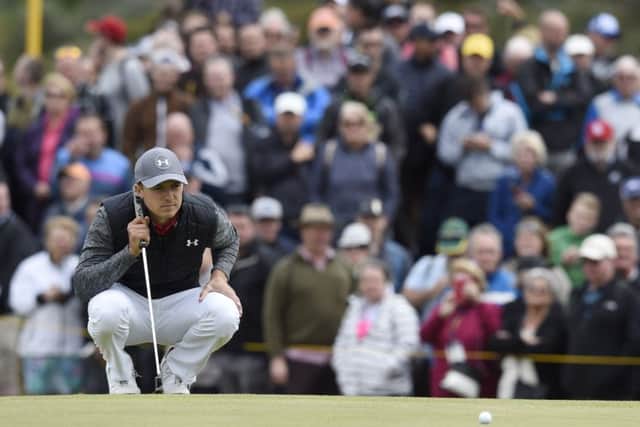 Jordan Spieth lines up his birdie putt on the 9th hole during the Open Golf first round. Picture Ian Rutherford