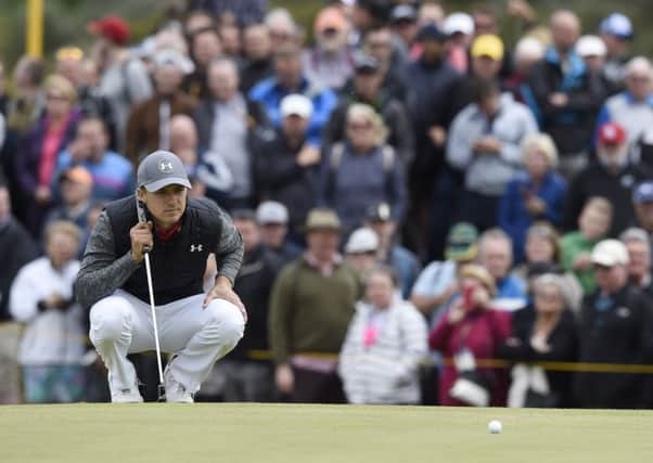 Jordan Spieth lines up his birdie putt on the 9th hole during the Open Golf first round. Picture Ian Rutherford