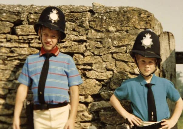 William and Harry dressed as policemen. Picture: PA