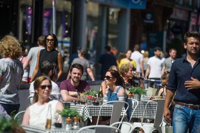 The warmer weather helped drive footfall on the high street. Picture: John Devlin