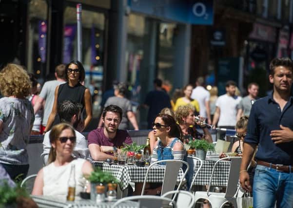 The warmer weather helped drive footfall on the high street. Picture: John Devlin