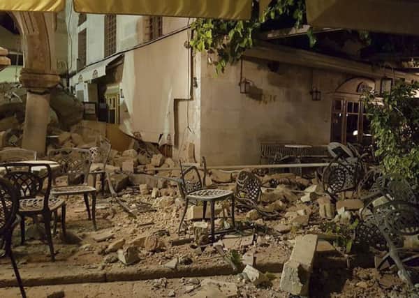 A cafe setting is littered with rubble following a strong earthquake on the Greek island of Kos. Picture; AP