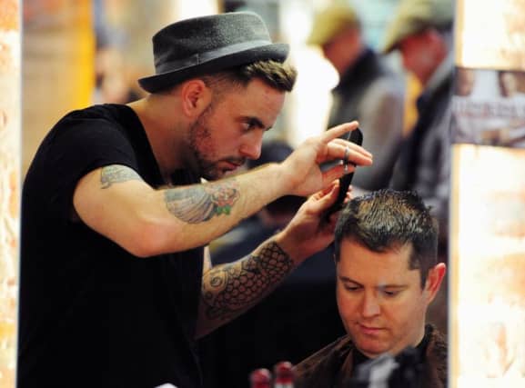 13/12/2012, TSPL, Scotsman, Scotland on Sunday, Peter Ross Notebbok feature. Rebel Rebel Babers shop in Union Street Glasgow. Hairdresser Mark Andrew cuts hair. Picture Ian Rutherford