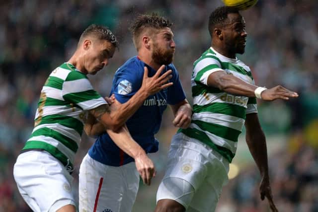 Mikael Lustig, left, in action for Celtic against Linfield. Photograph: Getty Images