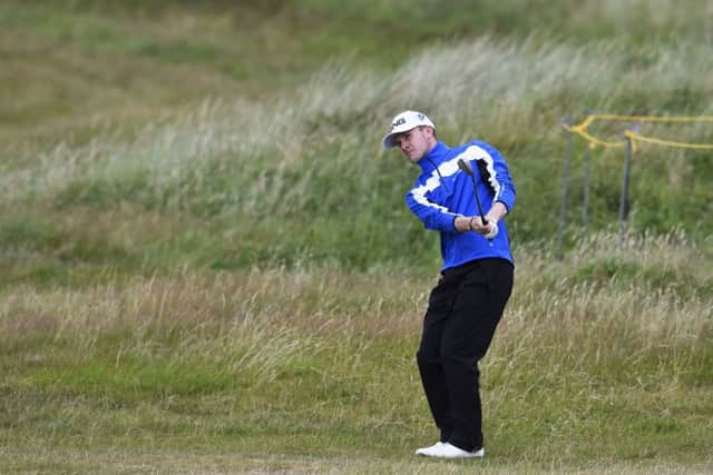 Connor Syme plays his chip shot to the 13th during the second round. Picture Ian Rutherford