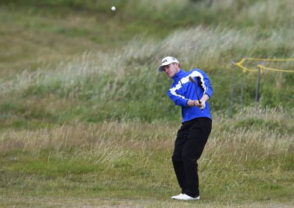 Connor Syme plays his chip shot to the 13th during the second round. Picture Ian Rutherford