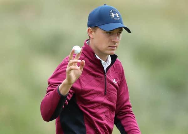 Jordan Spieth acknowledges the crowd after sinking a putt. Picture: Andrew Matthews/PA Wire