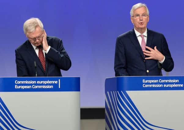 Brexit minister David Davis listens to EU chief negotiator Michel Barnier. Picture: Thierry Charlier/Getty