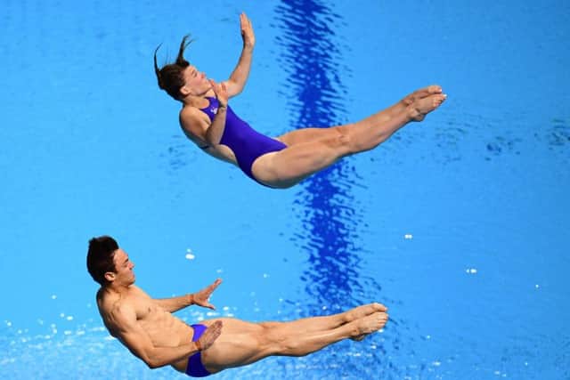Great Britain's Grace Reid and Tom Daley won silver in the mixed 3m synchro springboard final. Picture: MARTIN BUREAU/AFP/Getty Images