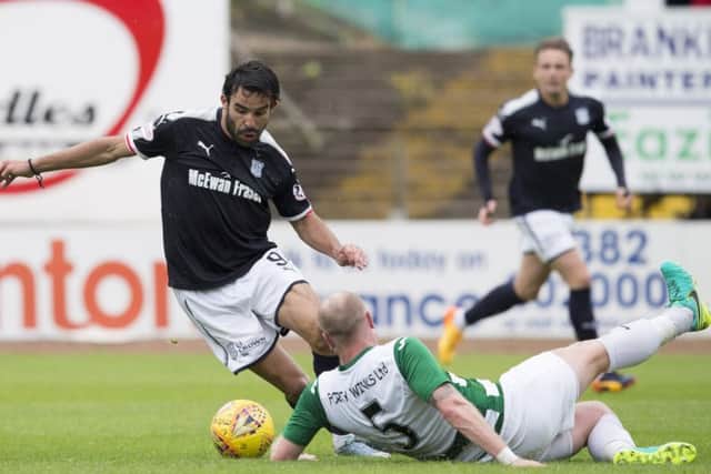 Dundee's Sofien Moussa battles for the ball against Buckie Thistle's Lewis Mackinnon. Picture: SNS/Kenny Smith
