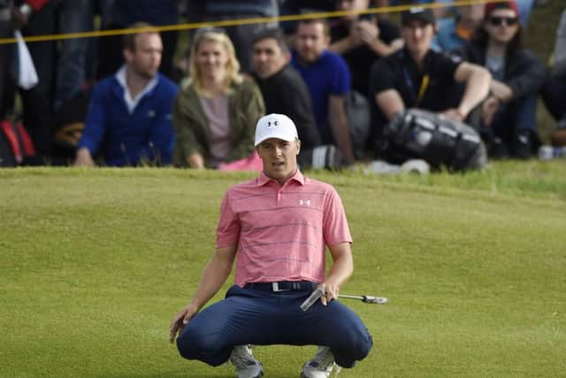 Jordan Spieth looks on in disbelief as his eagle putt on the 15th goes long. Photograph: Ian Rutherford