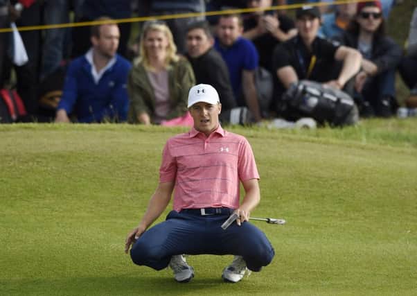 Jordan Spieth looks on in disbelief as his eagle putt on the 15th goes long. Photograph: Ian Rutherford