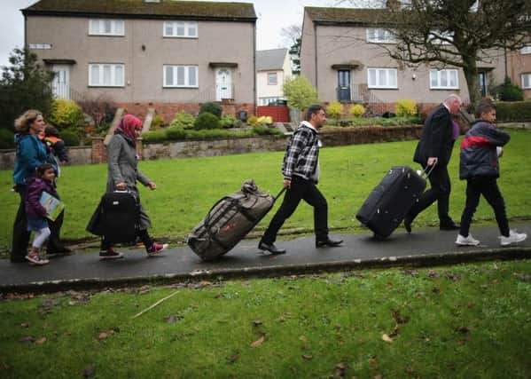 Syrian refugee families arrive at their new homes on the Isle of Bute. Picture: Christopher Furlong/Getty Images