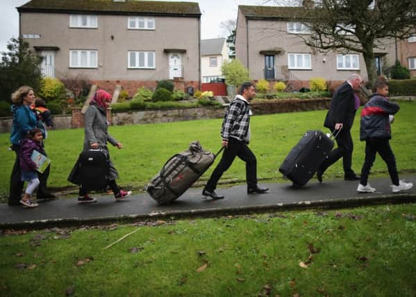 Syrian refugee families arrive at their new homes on the Isle of Bute. Picture:  Christopher Furlong/Getty Images