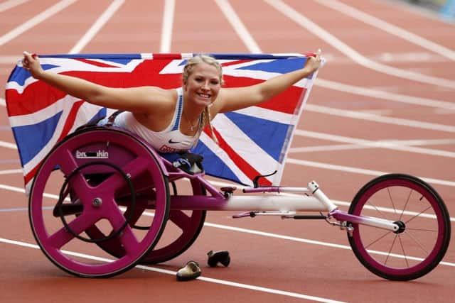 Sammi Kinghorn celebrates after winning the Womens 100m T53 final at the World Para-athletics Championships. PA