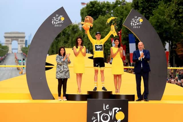 Chris Froome celebrates his Tour de France victory with his wife and so. Picture: PA.