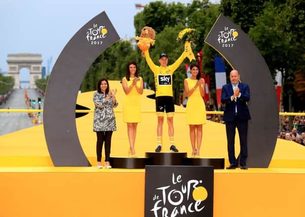 Chris Froome celebrates his Tour de France victory with his wife and so. Picture: PA.