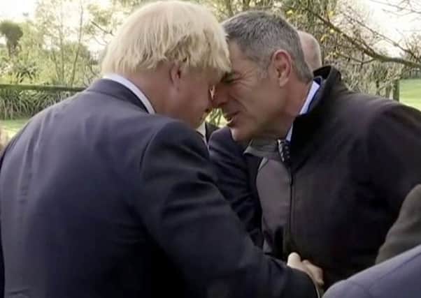 Boris Johnson, left, performs a traditional Maori greeting with New Zealand's Minister for Primary Industries Nathan Guy. Picture: AP