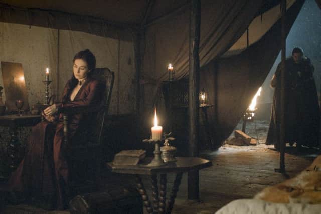 Carice van Houten as Melisandre and 
Kit Harington as Jon Snow