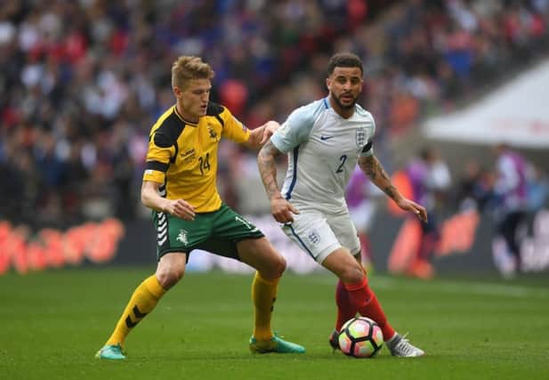 Vykintas Slivka attempts to dispossess Kyle Walker during a match between Lithuania and England at Wembley. Picture: Getty